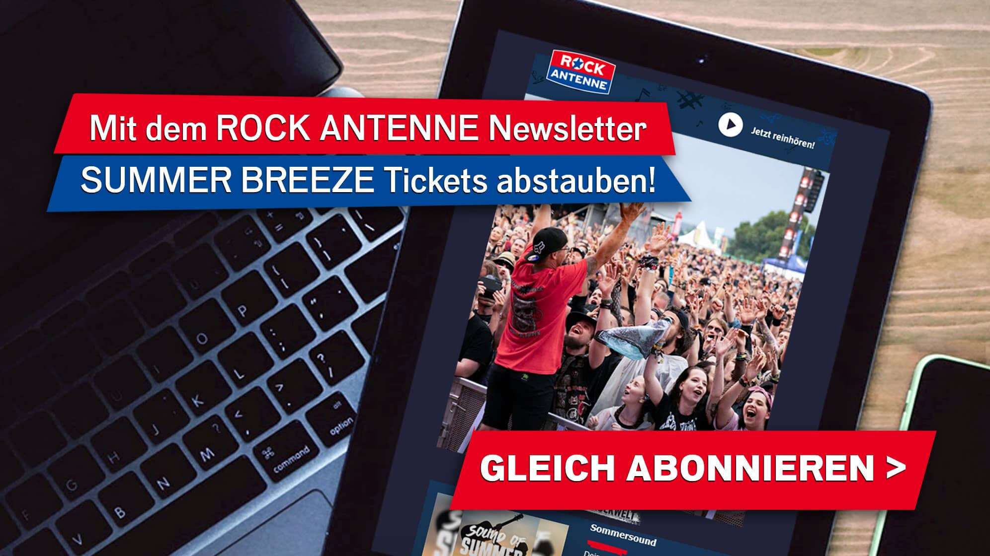 Ein Laptop, ein Tablet, ein Smartphone von oben fotografiert auf einem Tisch, auf dem Tablet ist der ROCK ANTENNE Newsletter geöffnet, dabei zu sehen ein Bild vom Summer Breeze Festival - dazu der Text: Mit dem ROCK ANTENNE Newsletter SUMMER BREEZE OPEN AIR Tickets abstauben! Gleich abonnieren!